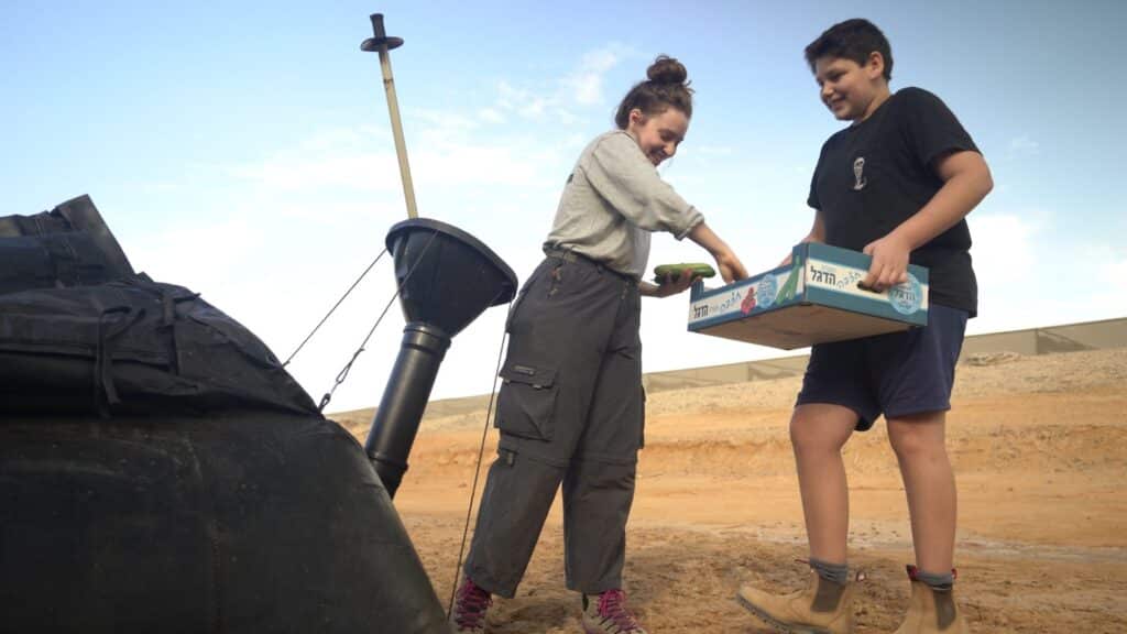 Throwing food waste to Homebiogas system in the Negev